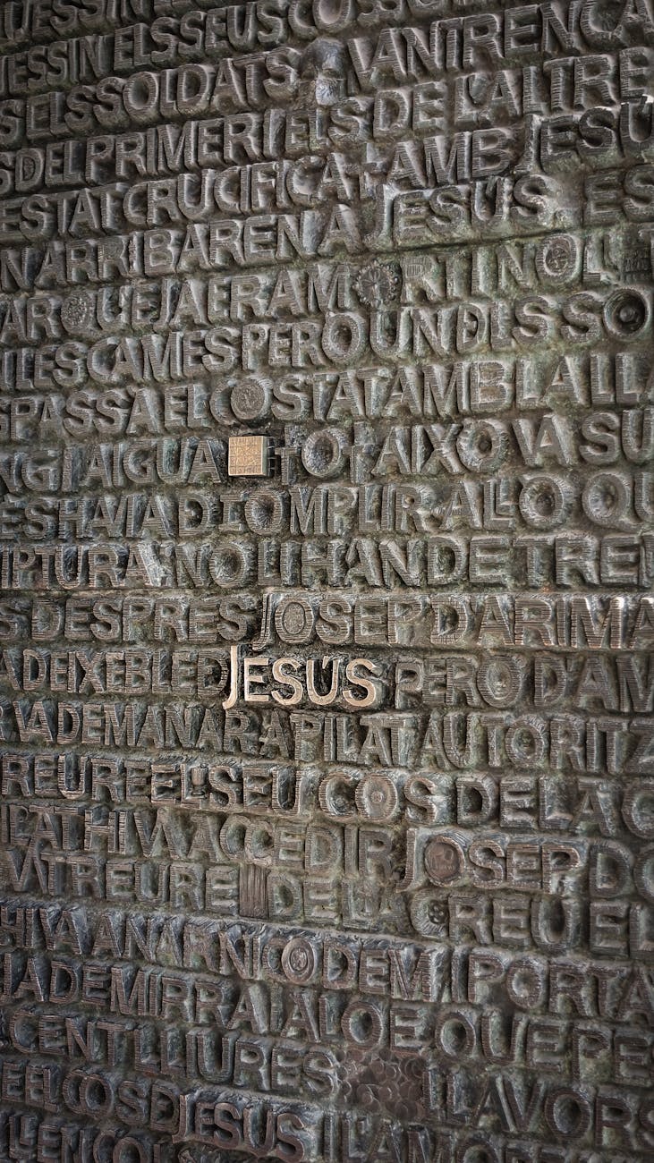 a gray concrete wall with biblical inscriptions
